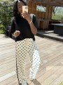 Pantalon blanc pois noir