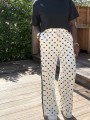 Pantalon blanc pois noir
